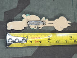 Early Plastic German Ski Pin