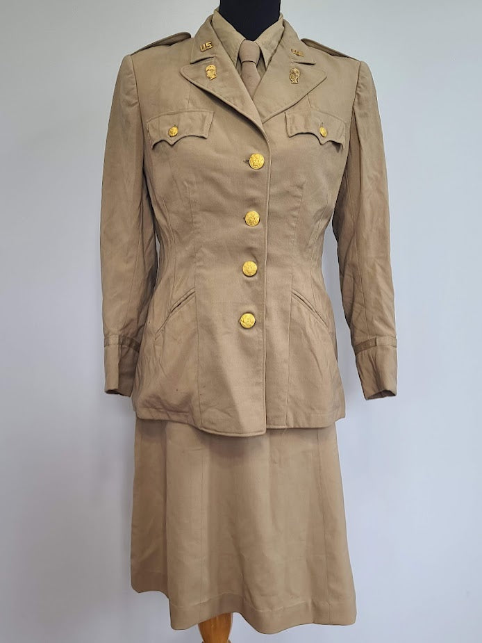 Khaki WAC Officer's Uniform: Jacket, Skirt, Blouse, Tie (B-37.5" W-30.75" H-40.5") Khaki WAC Officer's Uniform: Jacket, Skirt, Blouse, Tie (B-37.5" W-30.75" H-40.5")