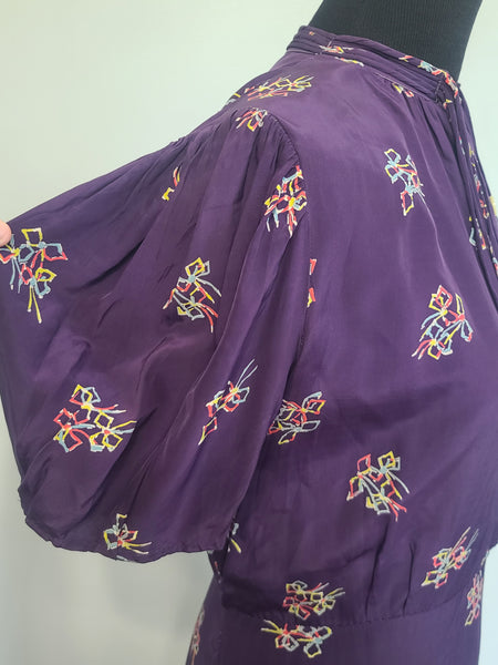 Purple Dress with Bow Print <br> (B-40" W-30" H-37")