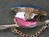 Early Plastic Hat and Sword Pin