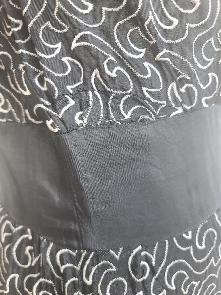 German Black Dress with White Swirl Designs <br> (B-40" W-29.5" H-41")