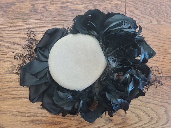 Beige Tilt Hat with Black Feathers