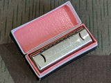 Tiny Hohner Puck Harmonica