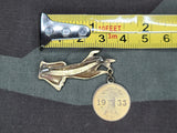 Hand with Reichspfennig 1933 Coin Pin