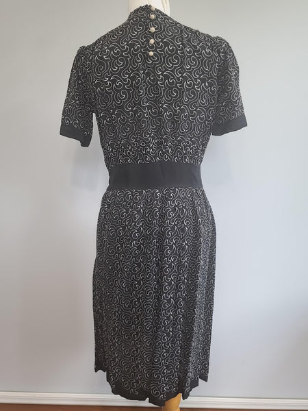 German Black Dress with White Swirl Designs <br> (B-40" W-29.5" H-41")