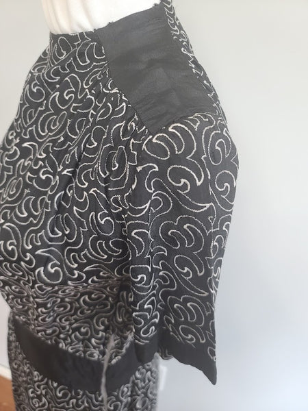 German Black Dress with White Swirl Designs <br> (B-40" W-29.5" H-41")