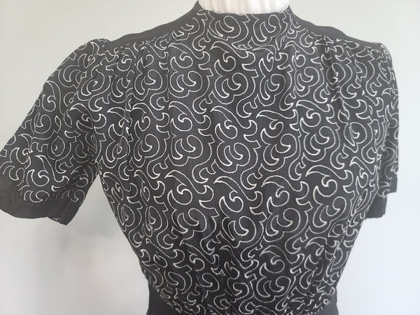 German Black Dress with White Swirl Designs <br> (B-40" W-29.5" H-41")