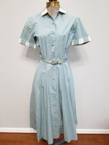 Light Blue Button Down Dress w Belt (B-37" W-24" H-38") Light Blue Button Down Dress w Belt (B-37" W-24" H-38")