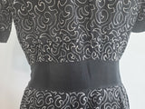 German Black Dress with White Swirl Designs <br> (B-40" W-29.5" H-41")