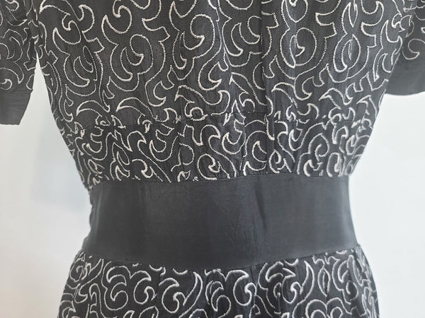German Black Dress with White Swirl Designs <br> (B-40" W-29.5" H-41")