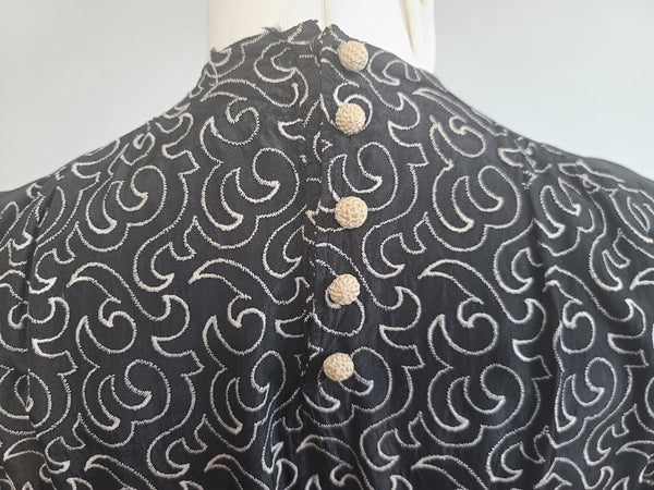 German Black Dress with White Swirl Designs <br> (B-40" W-29.5" H-41")