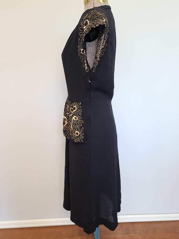 Black Rayon Peplum Dress with Gold Sequins and Soutache (B-33" W-26" H-35") Black Rayon Peplum Dress with Gold Sequins and Soutache (B-33" W-26" H-35")
