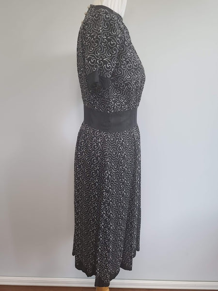 German Black Dress with White Swirl Designs <br> (B-40" W-29.5" H-41")
